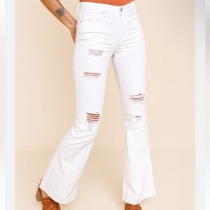 White distressed high rise flare jeans